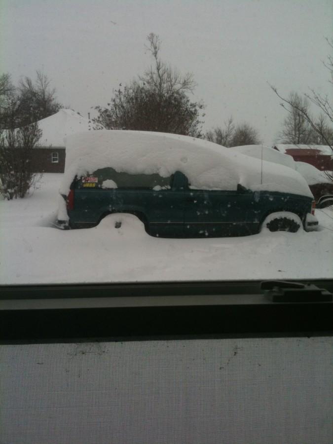 Senior Trent Wallis' truck gets buried under more than 20 inches of snow that fell upon Northwest Arkansas Feb. 9. Photo by Trent Wallis