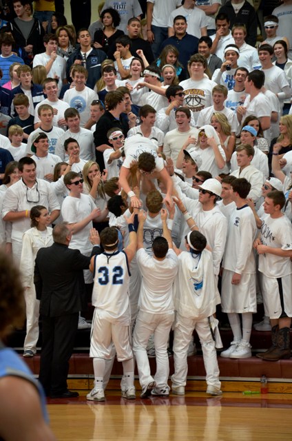 Griffin surfs student section