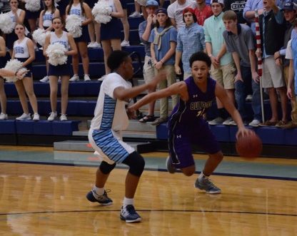 Sophomore Tylor Perry defends the ball against Fayetteville Jan. 20 in Wildcat Arena. Perry scored 13 points in the 60-59 conference win over the Bulldogs. Har-Ber has started the conference season with five straight wins. 