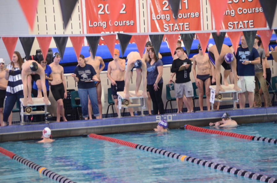 Swim team dives into early morning routine