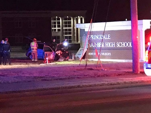 Springdale police responded to a 911 call after a woman crashed into the sign