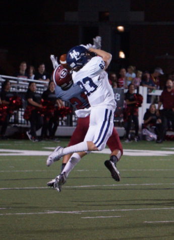 Sophomore wide receiver Walker Immel goes up for a pass against the Springdale Bulldogs at Jarrell Williams Bulldog Stadium Oct. 5. The Bulldogs defeated the Wildcats 43-42, their first conference win over HBHS in 11 years.
The original photo was removed at the request of Randy Hutchinson, co-owner of 5H Photography and member of Springdale School Board.