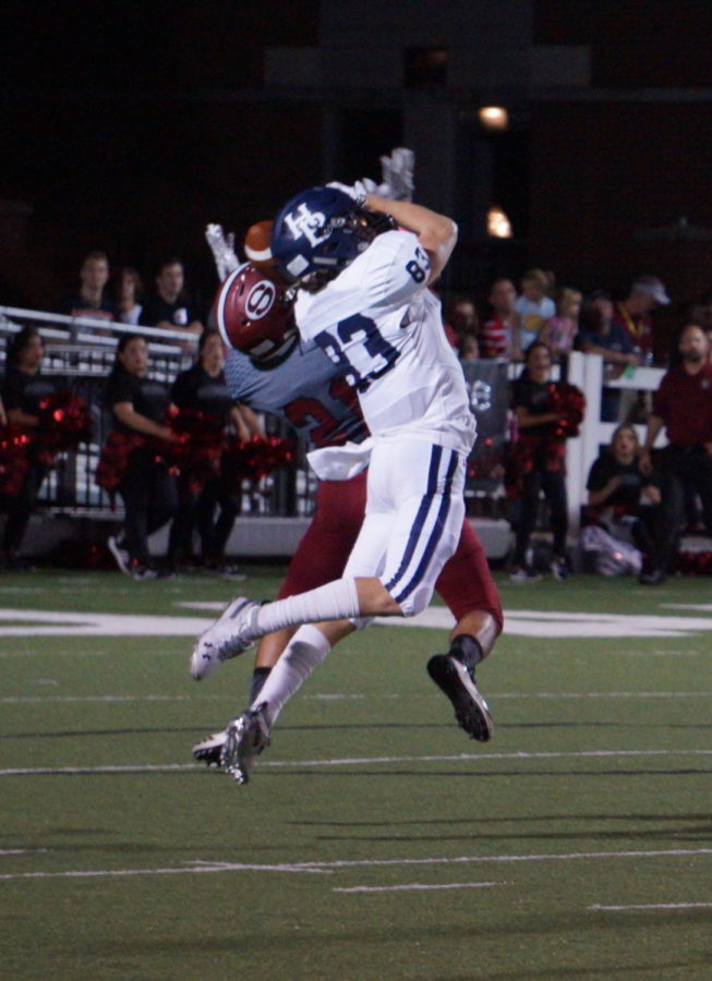 Sophomore wide receiver Walker Immel goes up for a pass against the Springdale Bulldogs at Jarrell Williams Bulldog Stadium Oct. 5. The Bulldogs defeated the Wildcats 43-42, their first conference win over HBHS in 11 years. 

The original photo was removed at the request of Randy Hutchinson, co-owner of 5H Photography and member of Springdale School Board. 