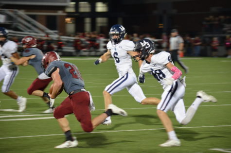 Junior free safety Ty Copher (6) and junior corner back Matt Wright (48) runs down a Bulldog during the Oct. 5 conference game at Jarrell Williams Bulldog Stadium. The Bulldogs beat the Wildcats 43-42 for the first time in 11 years.
The original photo was removed at the request of Randy Hutchinson, co-owner of 5H Photography and member of Springdale School Board.