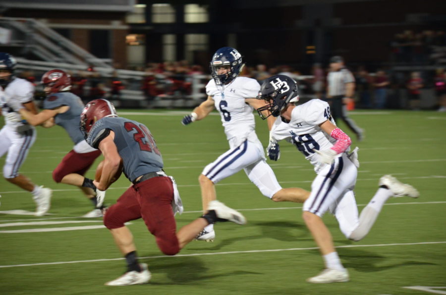 Junior free safety Ty Copher (6) and junior corner back Matt Wright (48) runs down a Bulldog during the Oct. 5 conference game at Jarrell Williams Bulldog Stadium. The Bulldogs beat the Wildcats 43-42 for the first time in 11 years.

The original photo was removed at the request of Randy Hutchinson, co-owner of 5H Photography and member of Springdale School Board.