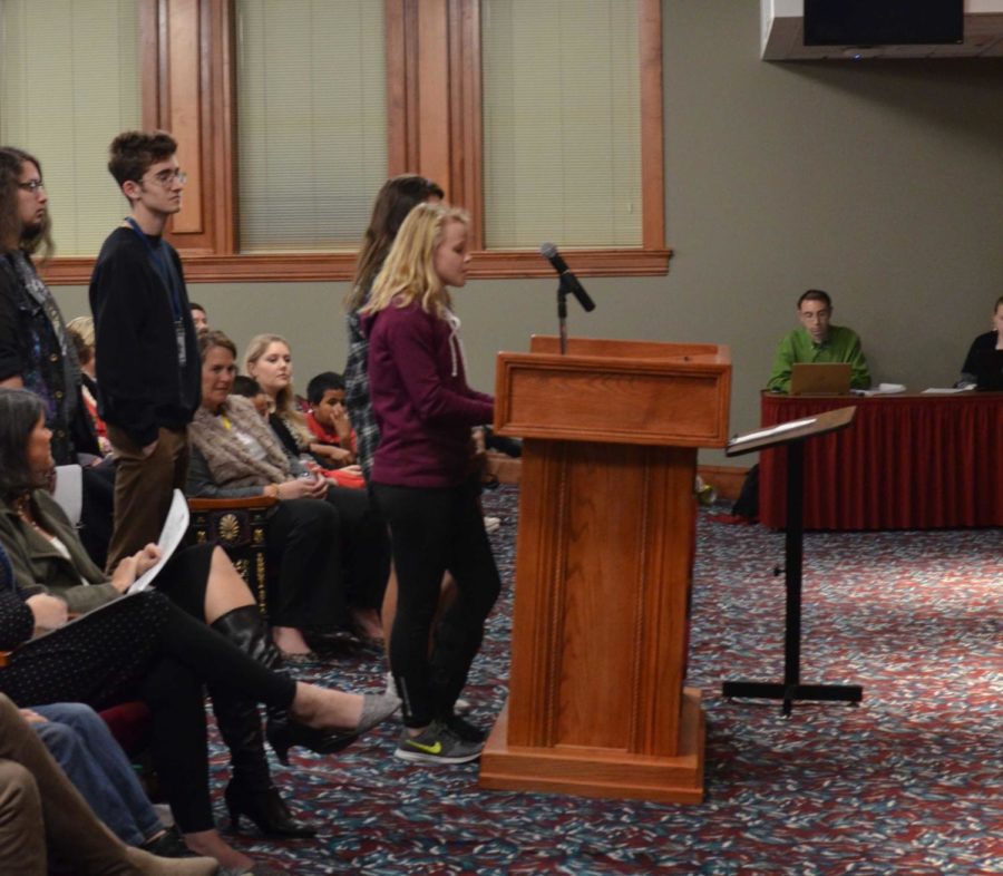 Students from the Wildcat yearbook and The Herald staff speak to the Springdale school board Dec. 11.