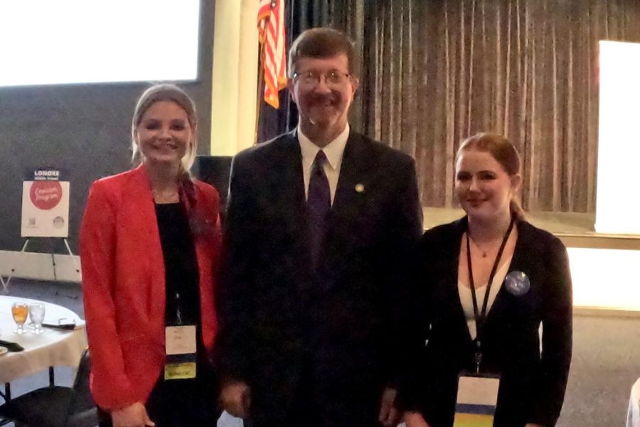 Debate students Tommie Carnahan and Emily Taylor visit with the Commissioner of Eductation of the Arkansas Department of Education Johnny Key in September. 