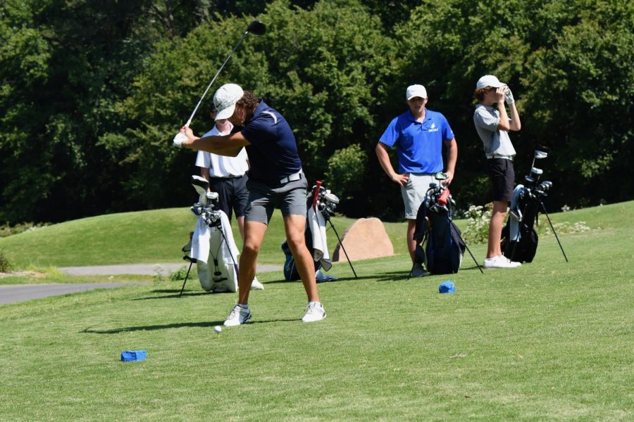 Junior Carter Moss loads his driver to hit the ball off the tee in a match in Bella Vista. 