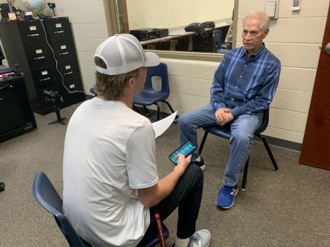 Junior reporter Grayson Spurlock interviews sports journalist Chris Mortensen during a visit he made to campus in November. 