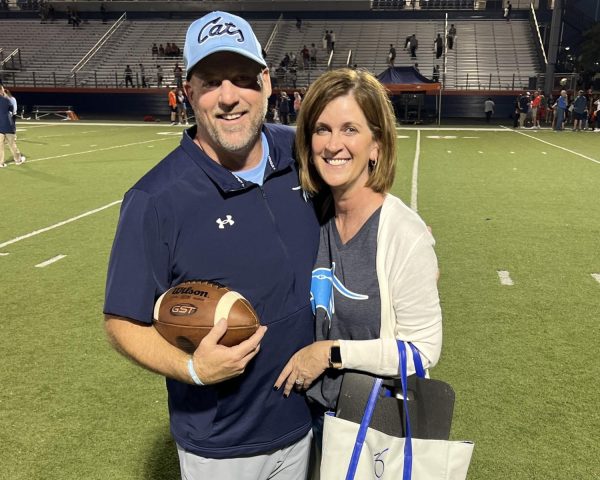 Head football coach Brent Eckley received the game ball after securing his first win as a Wildcat over the Heritage War Eagles on Sept. 29. He and his wife Sherene moved to Northwest Arkansas from Jackson, Mo. to take over the football program. The Cats defeated the conference opponent 61-13. 
