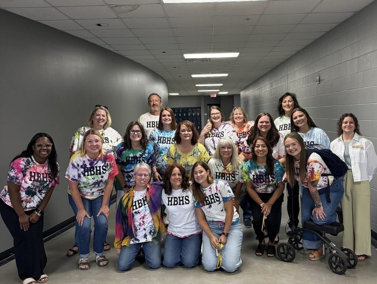 Members of the English department wear their tye-dyed shirts on the first day of school. During teacher in-service week, staff had the opportunity to dye shirts as part of a team-building activity. 