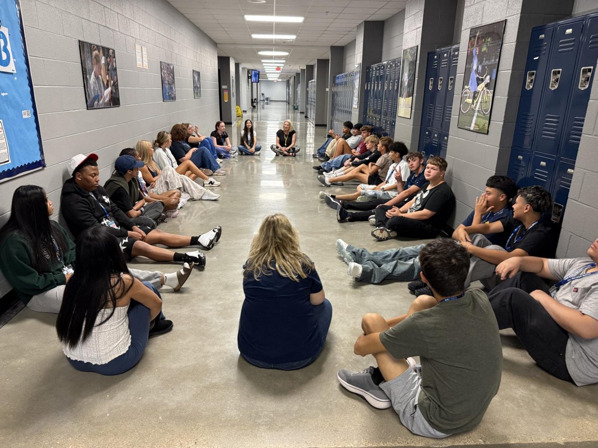English 11 students in Mrs. Felder's class practice learning classmates' name during a get-to-know-you activity. 